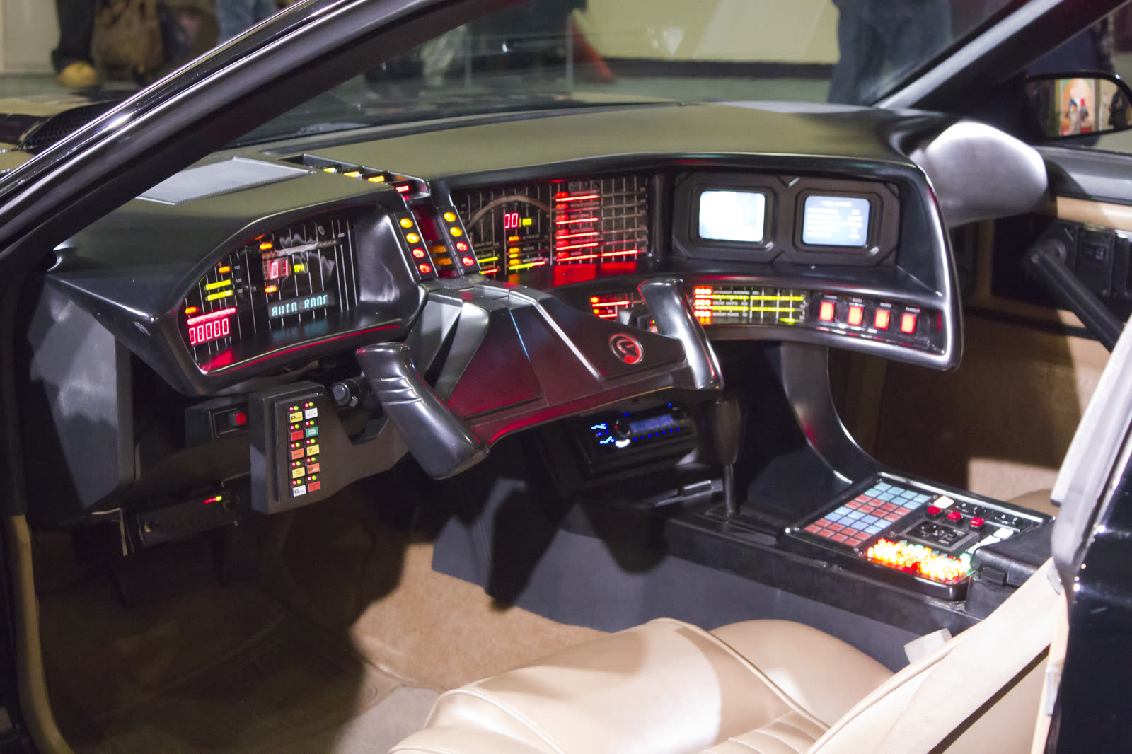 KITT's dashboard with twin screens, a steering yoke and rows of buttons