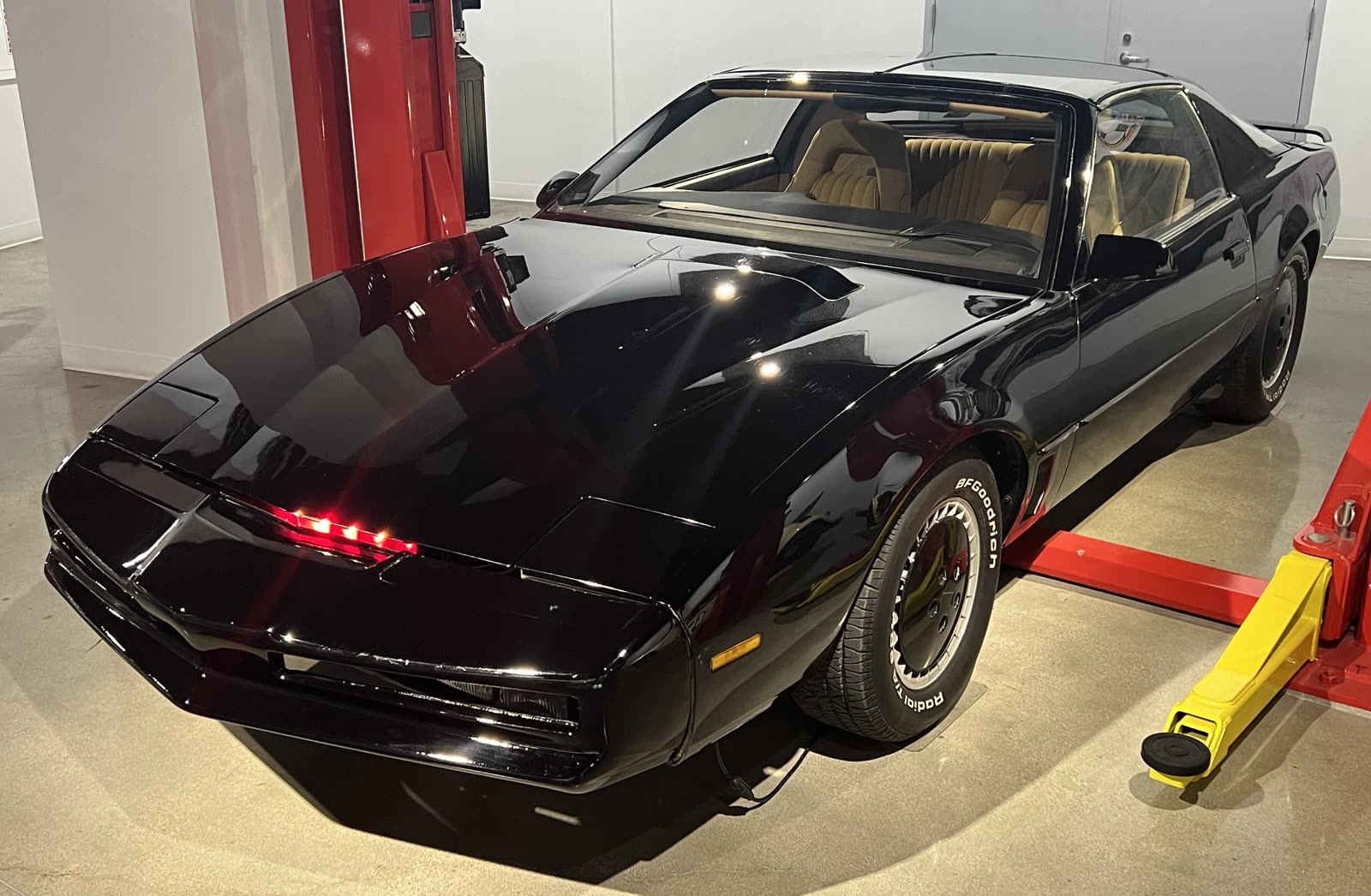 Black 1982 Pontiac Trans Am KITT with its red scanner lit, at the Petersen Automotive Museum